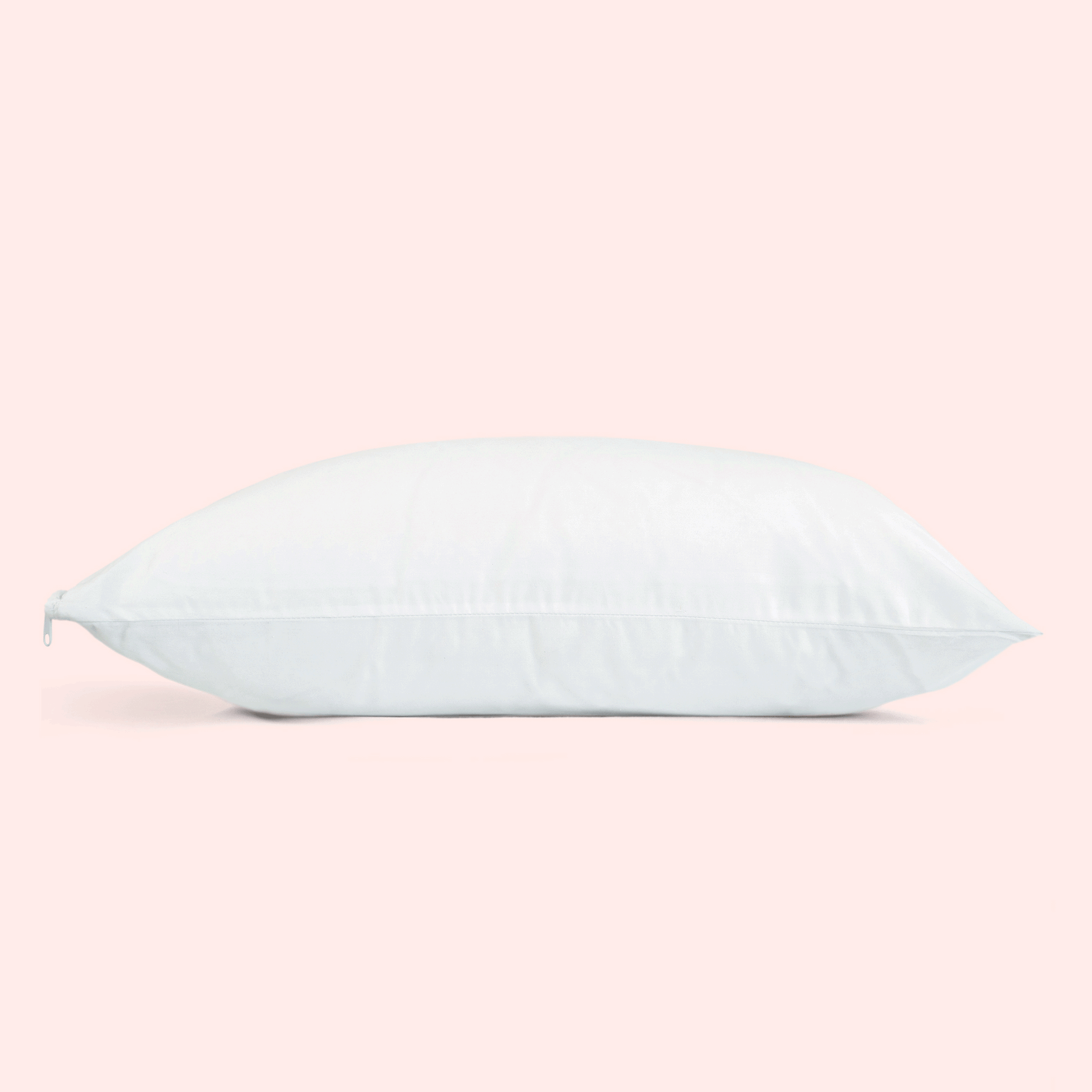 una imagen gif en un fondo rosado donde se muestra una almohada blanca y sobre ella una sandia que aparece y desaparece.